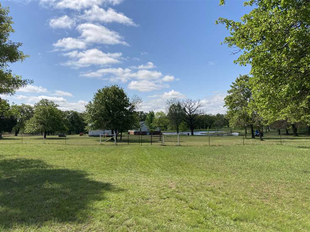 Patio Sitting with Pond View on 40 Acres Real estate listing